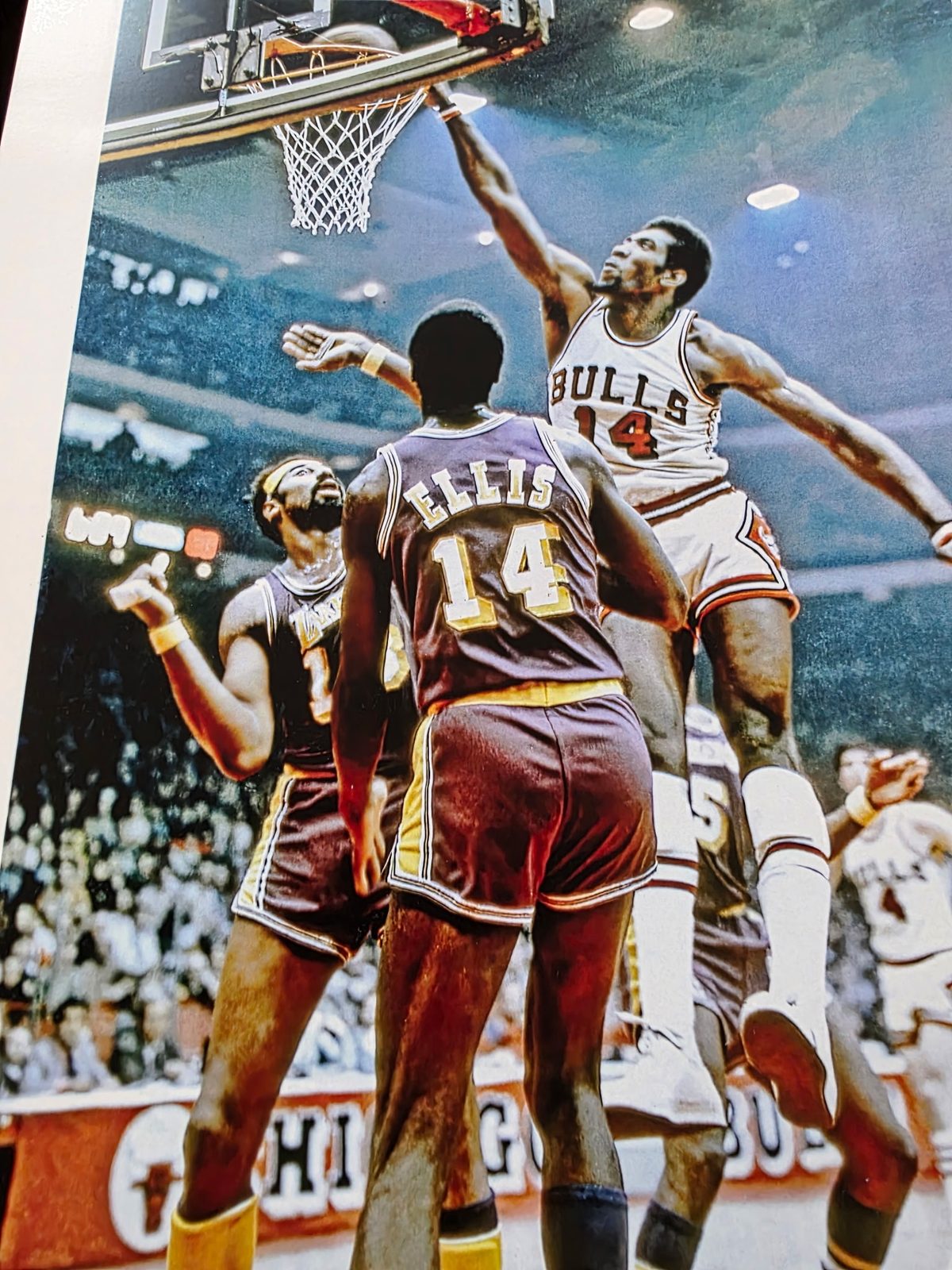Vintage photo of Clifford Ray in a Warriors uniform going up for a rebound against the Bulls